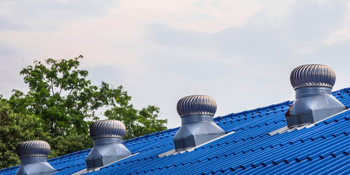 Roof ventilators on a blue roof