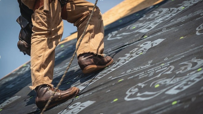 man walking on roof